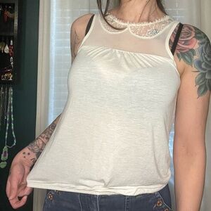 Cream sleeveless top with mesh/lace collar